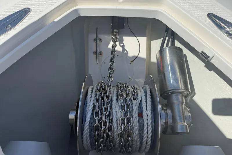 Slide: The Image of Anchor winch system on 2024 SeaVee 390Z boat, featuring chain and rope. - 21
