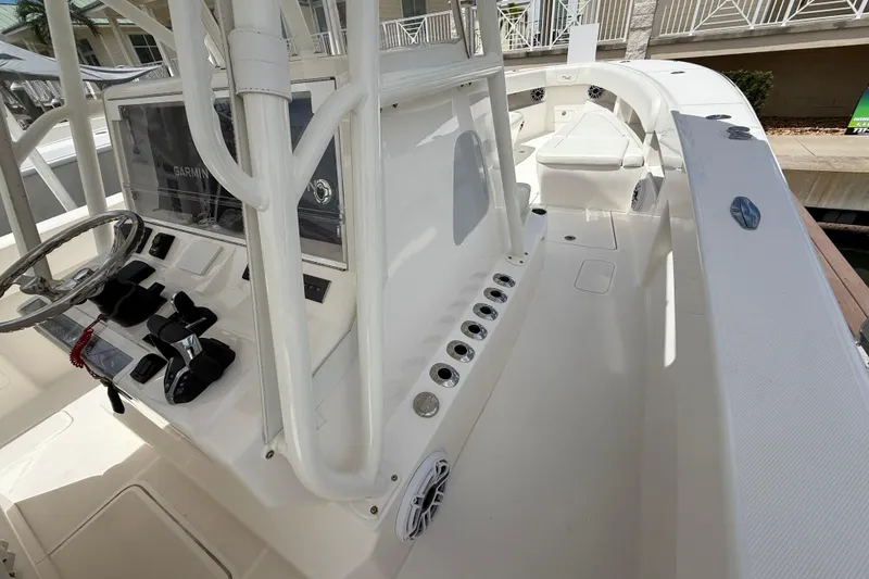 Slide: The Image of 2024 SeaVee 390Z boat interior with steering wheel, controls, and seating area. - 4