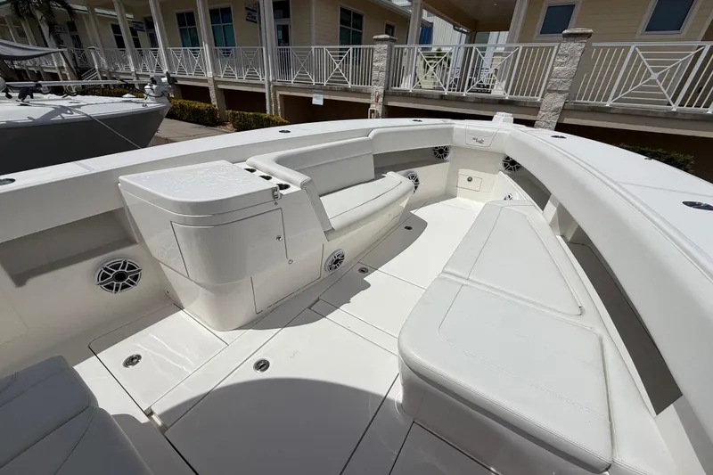 Slide: The Image of 2024 SeaVee 390Z boat interior with white seating and storage compartments. - 5