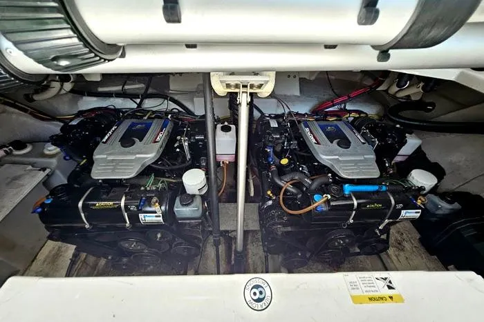 Slide: The Image of 2008 Bayliner 320 engine compartment with dual inboard motors. - 23