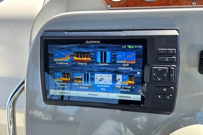 Slide: The Image of Garmin navigation system on 2008 Bayliner 320 boat dashboard, displaying sonar options. - 8