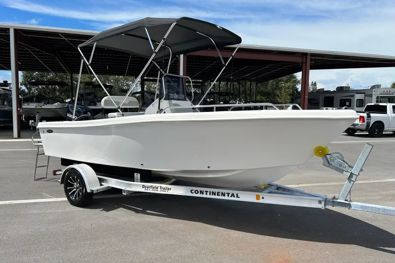 The Image of 2022 Key Largo 1800 Center Console boat on trailer in parking lot. - 1