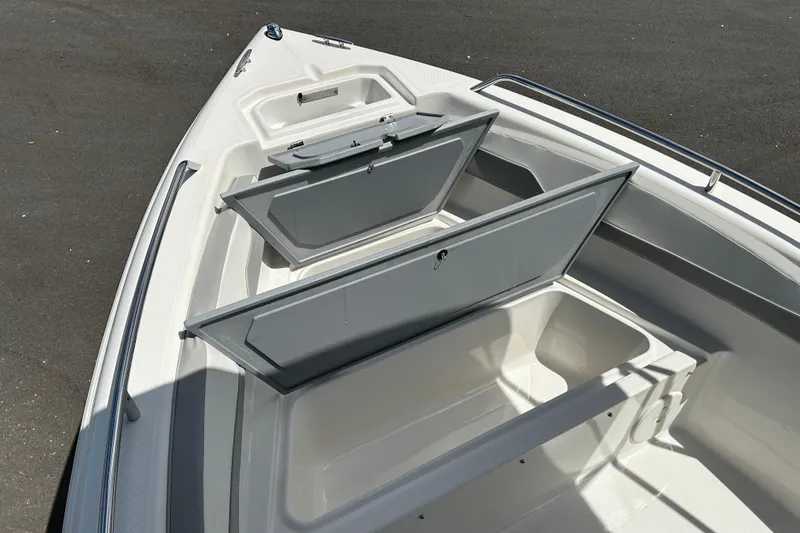 Slide: The Image of 2022 Key Largo 1800 Center Console boat with open storage compartments. - 14