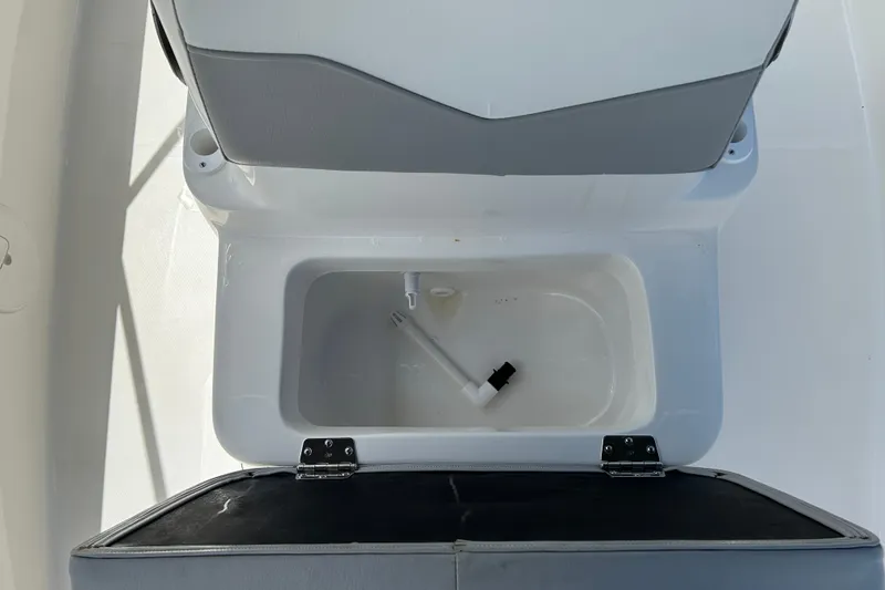 Slide: The Image of 2022 Key Largo 1800 Center Console boat seat with open storage compartment. - 15