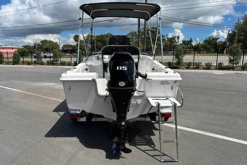 Slide: The Image of 2022 Key Largo 1800 Center Console boat with 115 HP engine and ladder. - 3