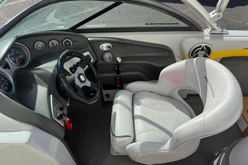 Slide: The Image of 2008 Moomba Mobius LS boat interior with steering wheel and dashboard controls. - 7