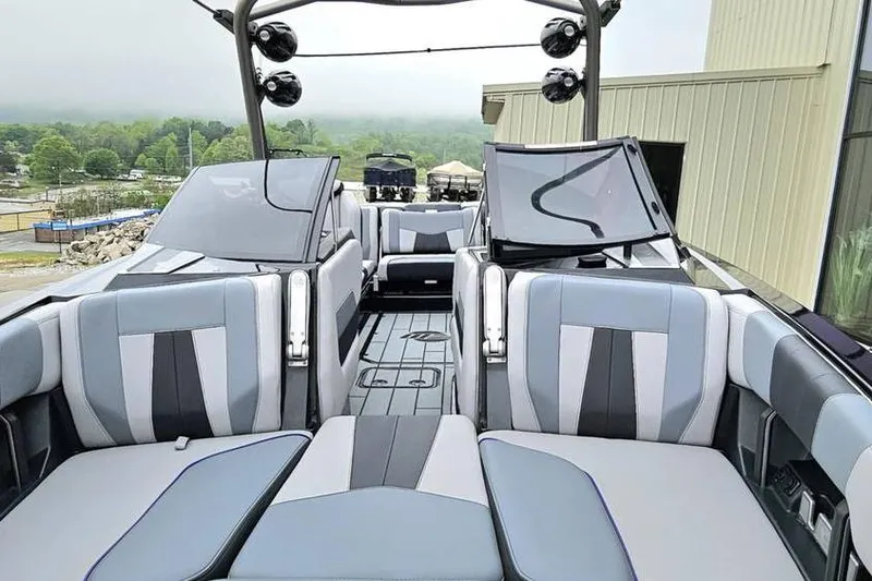 Slide: The Image of 2021 Malibu Wakesetter 23 MXZ interior with stylish seating and modern design. - 6