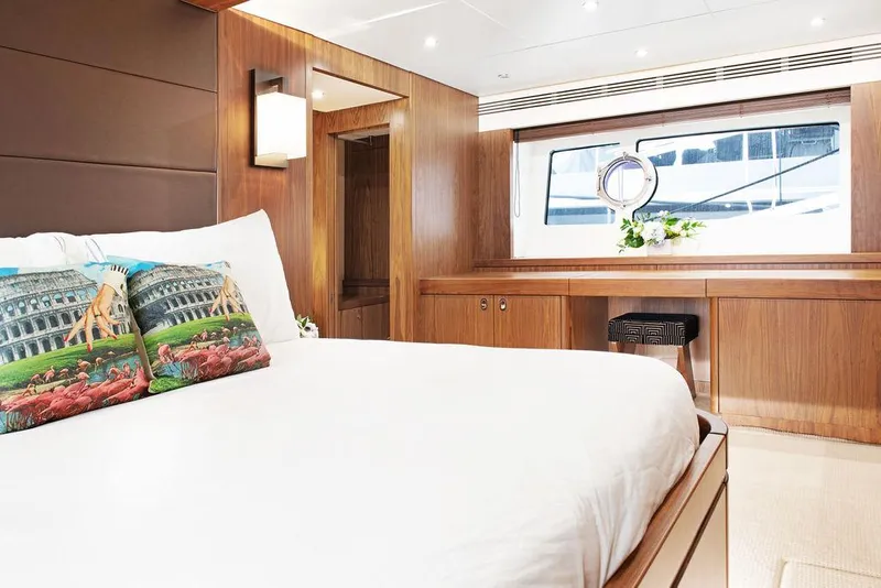 Slide: The Image of Luxurious Sunseeker 75 Yacht 2016 bedroom with elegant wood paneling and large window. - 19