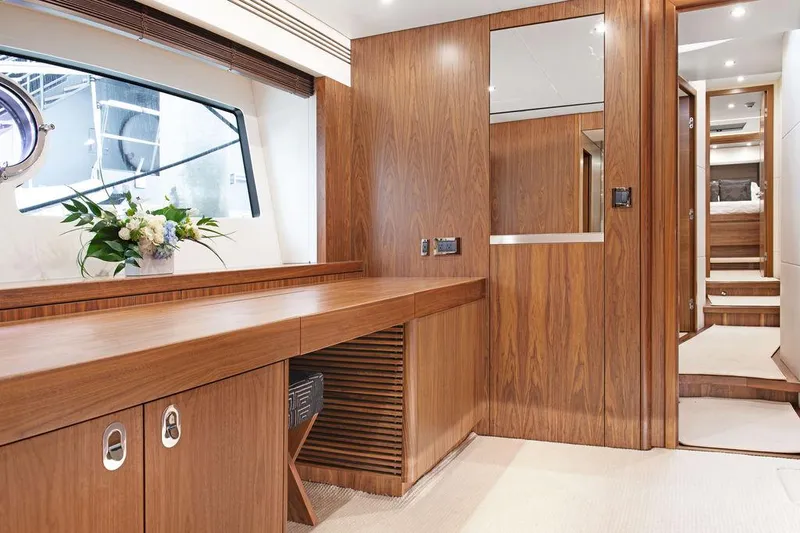 Slide: The Image of Luxurious interior of 2016 Sunseeker 75 Yacht with elegant wood finish and floral arrangement. - 23