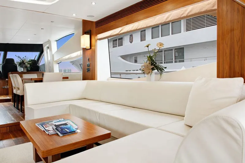 Slide: The Image of Luxurious interior of 2016 Sunseeker 75 Yacht with elegant white seating and wooden accents. - 27