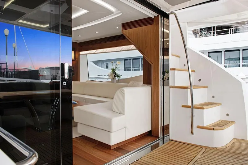 Slide: The Image of Luxurious interior of 2016 Sunseeker 75 Yacht with elegant seating and wooden staircase. - 31