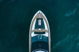Slide: The Image of Aerial view of 2016 Sunseeker 75 Yacht on deep blue water. - 8