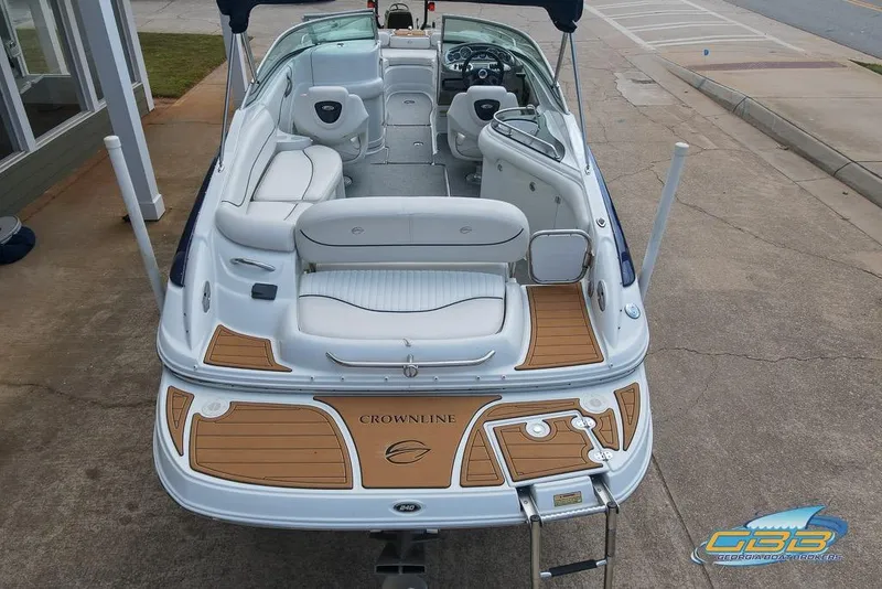 Slide: The Image of 2004 Crownline 240 EX boat with spacious seating and elegant design. - 13