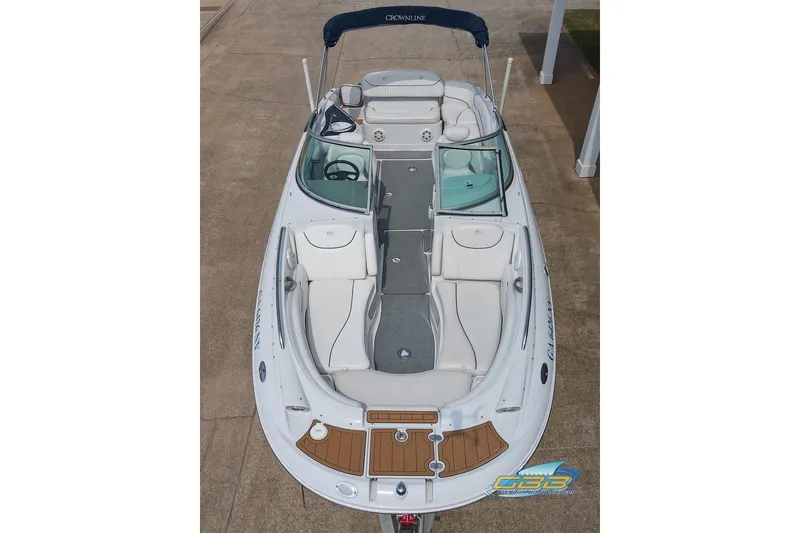 Slide: The Image of 2004 Crownline 240 EX boat, aerial view, showcasing spacious seating and sleek design. - 20