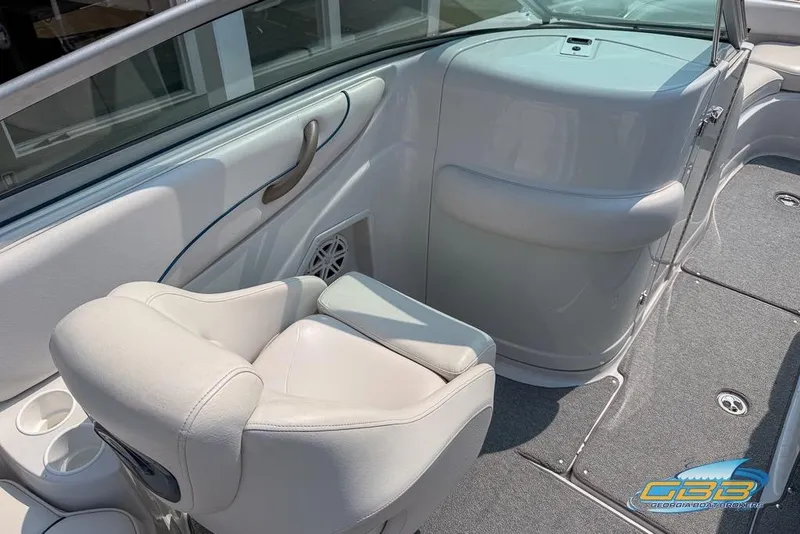 Slide: The Image of 2004 Crownline 240 EX boat interior with white seating and modern design. - 21