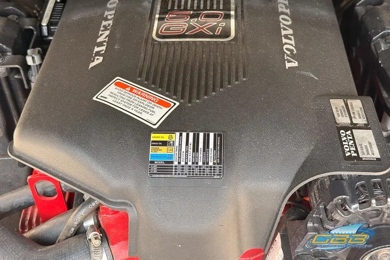 Slide: The Image of Engine of 2004 Crownline 240 EX boat, featuring Volvo Penta 5.0 GXi model. - 28