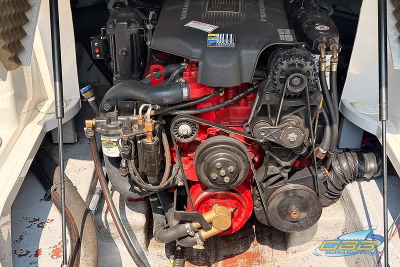 Slide: The Image of 2004 Crownline 240 EX boat engine, detailed view of mechanical components. - 29