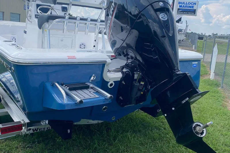 Slide: The Image of 2024 Tidewater 1910 Bay Max boat with powerful outboard motor, displayed at Bulloch Marine. - 1