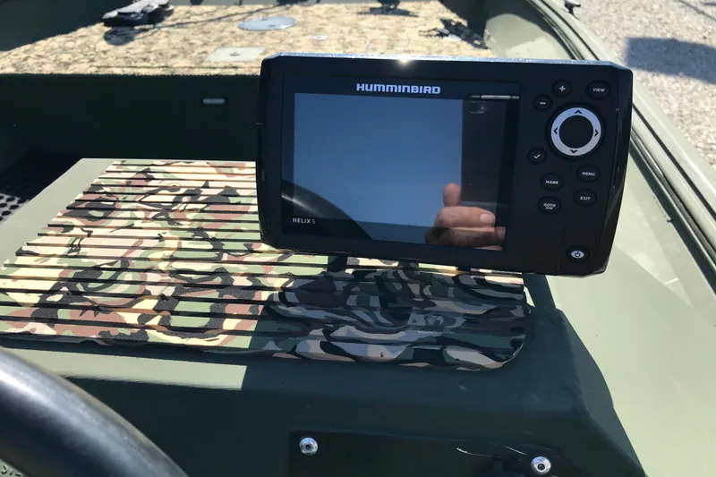 Slide: The Image of Humminbird Helix 5 fish finder on 2001 Lowe Roughneck 1860SC boat dashboard. - 10