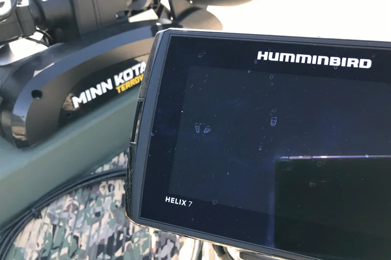 Slide: The Image of Fishfinder and trolling motor on 2001 Lowe Roughneck 1860SC boat. - 14