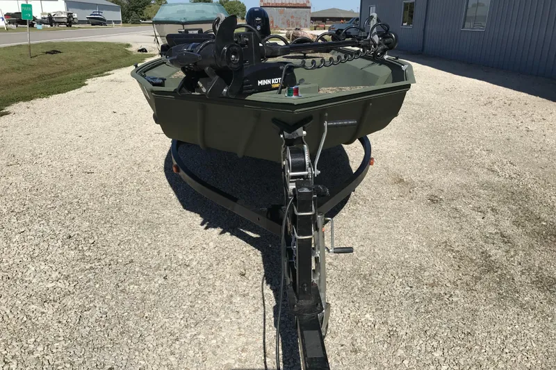 Slide: The Image of 2001 Lowe Roughneck 1860SC boat on trailer, equipped with Minn Kota trolling motor. - 19