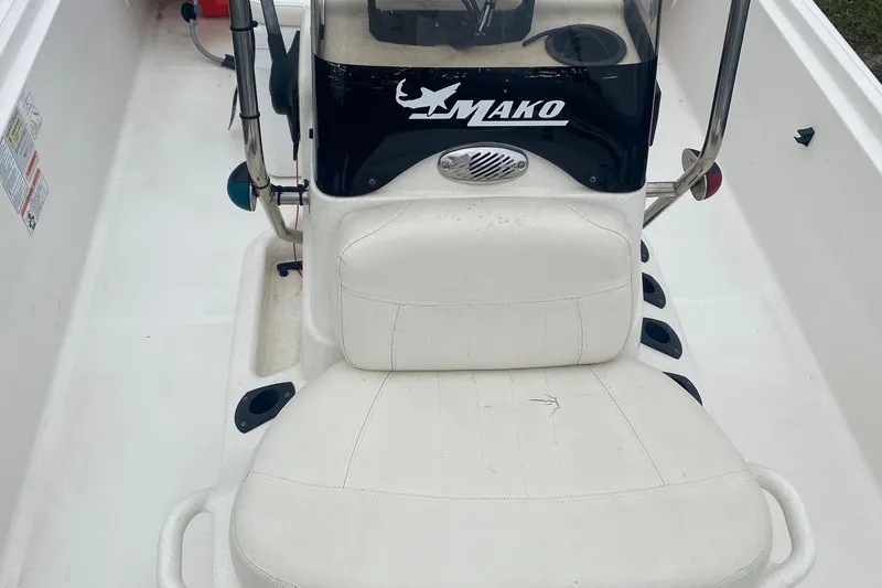 Slide: The Image of 2015 Mako 171 Center Console boat interior with white seating and console. - 7