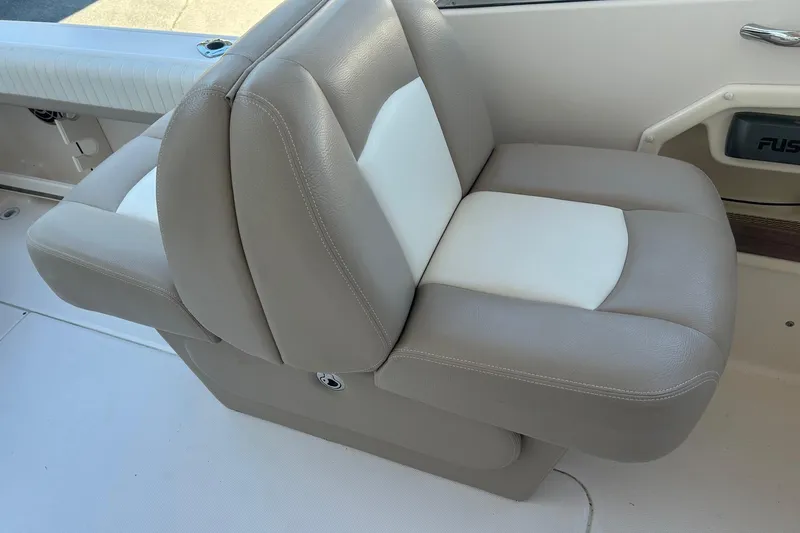Slide: The Image of 2013 Grady-White Freedom 255 boat seat, beige and white leather upholstery. - 5