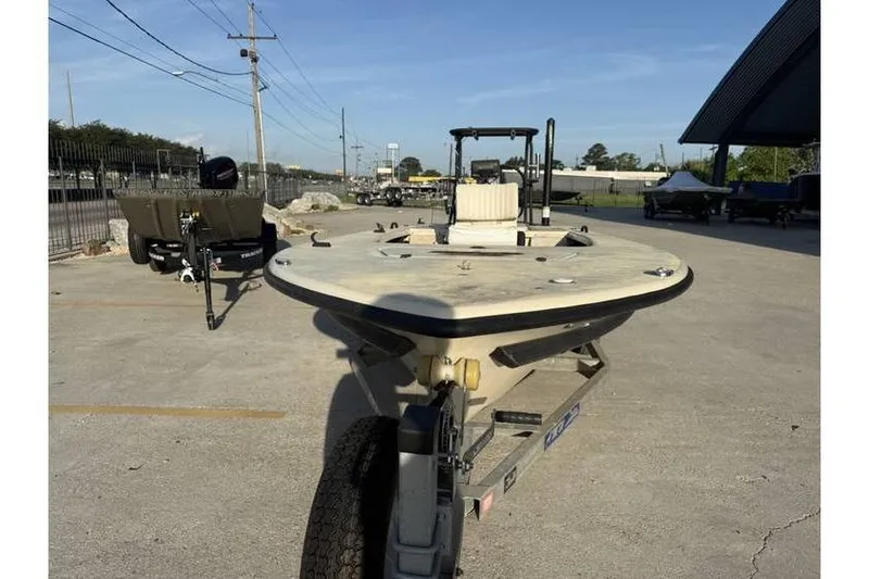 Slide: The Image of 2003 Buskens 17 Flats boat on trailer in outdoor lot. - 4