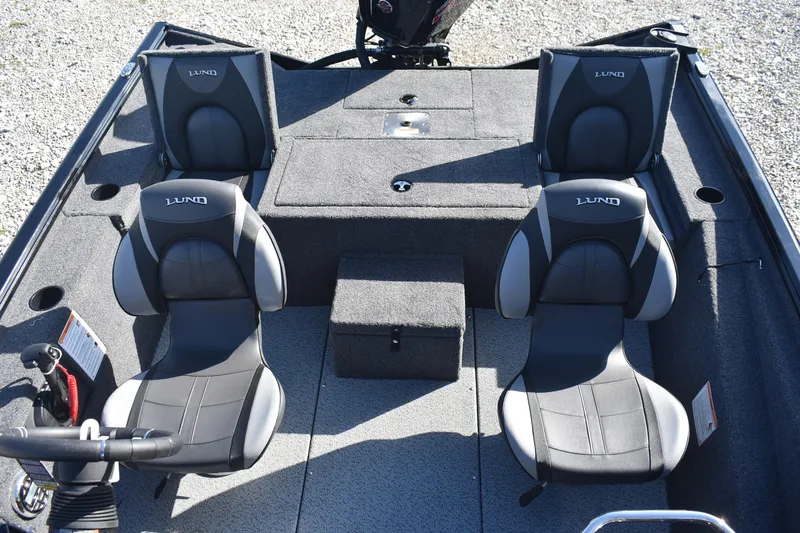 Slide: The Image of 2026 Lund 1875 Renegade boat interior with four black and gray seats. - 10