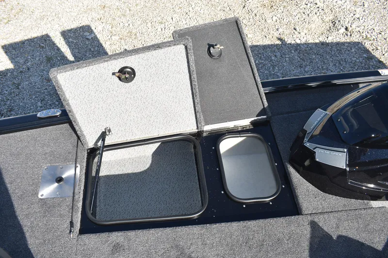 Slide: The Image of 2026 Lund 1875 Renegade boat interior with seating and storage compartments. - 11