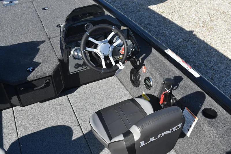 Slide: The Image of 2026 Lund 1875 Renegade boat storage compartments and deck details. - 16