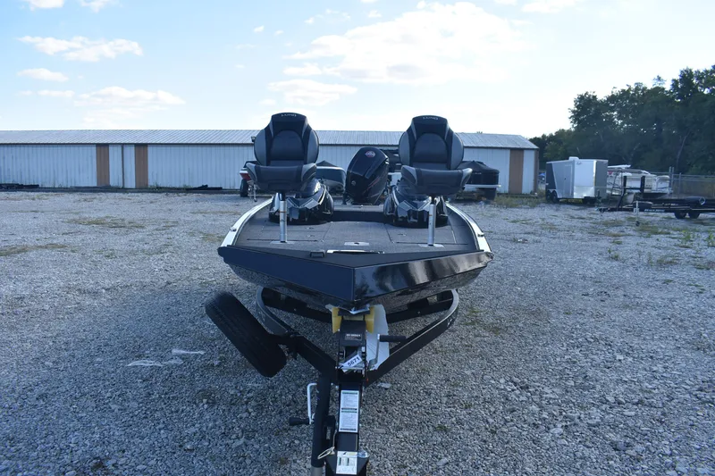 Slide: The Image of 2026 Lund 1875 Renegade boat on trailer in outdoor storage area. - 3