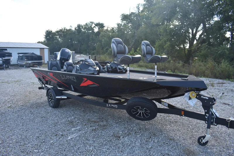 Slide: The Image of 2026 Lund 1875 Renegade boat on trailer in outdoor setting. - 4