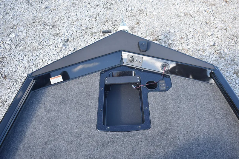 Slide: The Image of 2026 Lund 1875 Renegade boat with Mercury Pro XS engine, parked on gravel. - 7