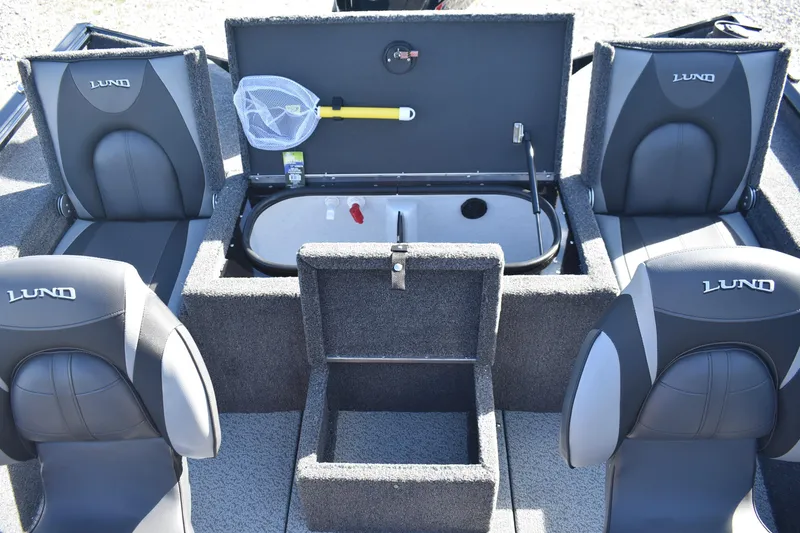 Slide: The Image of 2026 Lund 1875 Renegade boat interior with steering wheel and seating. - 9