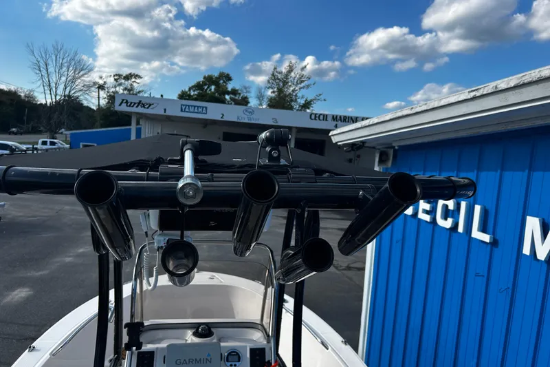 Slide: The Image of 2018 Robalo R180 Center Console boat with rod holders, parked at Cecil Marine. - 10
