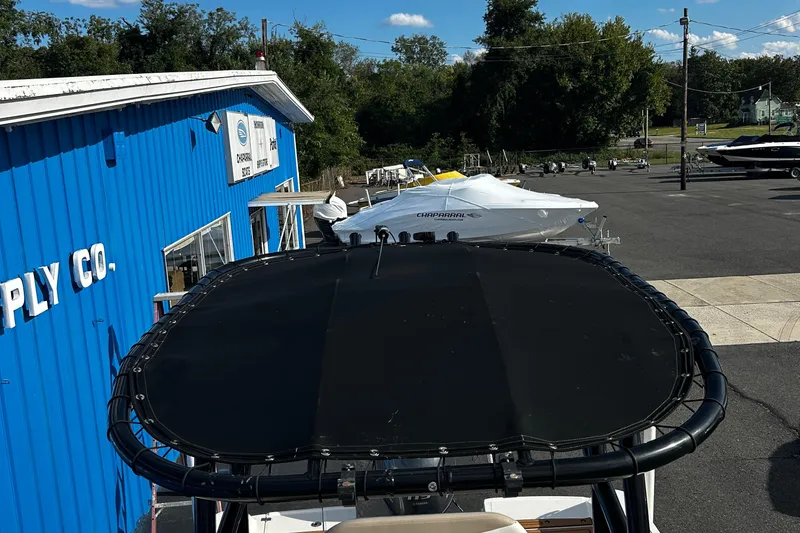 Slide: The Image of 2018 Robalo R180 Center Console boat at a marine supply store. - 11