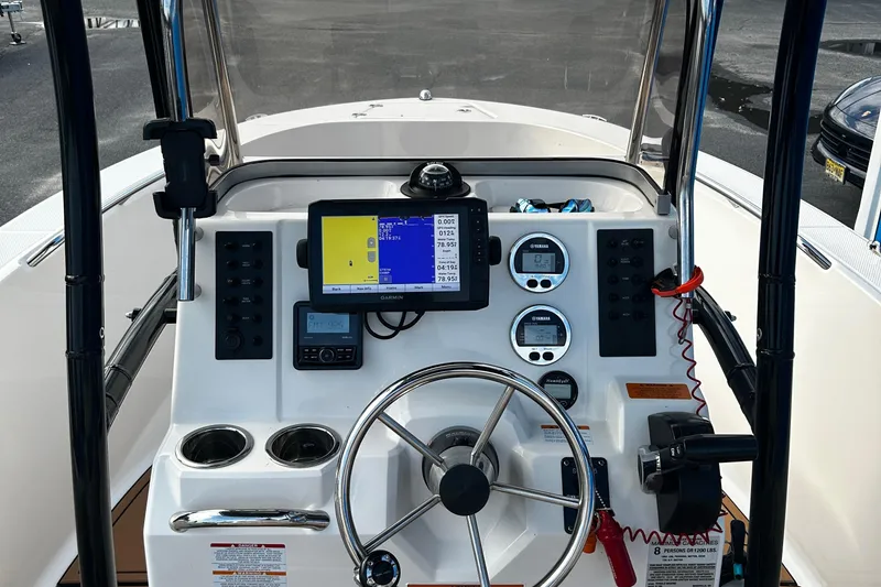 Slide: The Image of 2018 Robalo R180 Center Console boat dashboard with Garmin navigation system. - 12