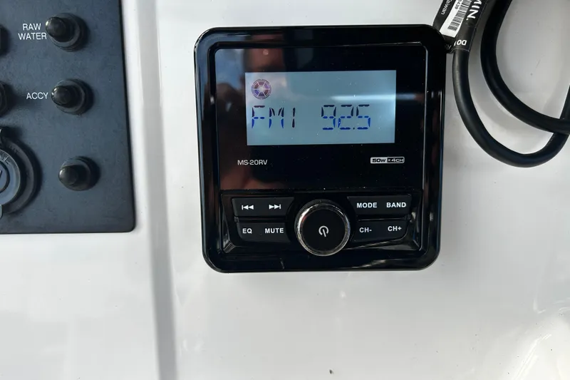 Slide: The Image of Control panel of a 2018 Robalo R180 Center Console boat with radio display. - 18