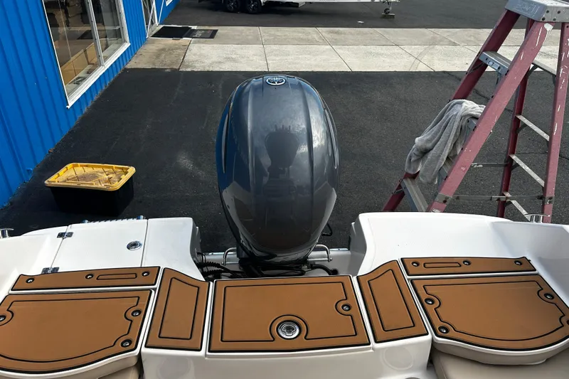 Slide: The Image of 2018 Robalo R180 Center Console boat with outboard motor and deck view. - 27