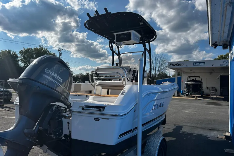Slide: The Image of 2018 Robalo R180 Center Console boat with Yamaha engine in a sunny outdoor setting. - 3