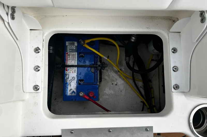 Slide: The Image of 2018 Robalo R180 Center Console boat battery compartment with wiring. - 30