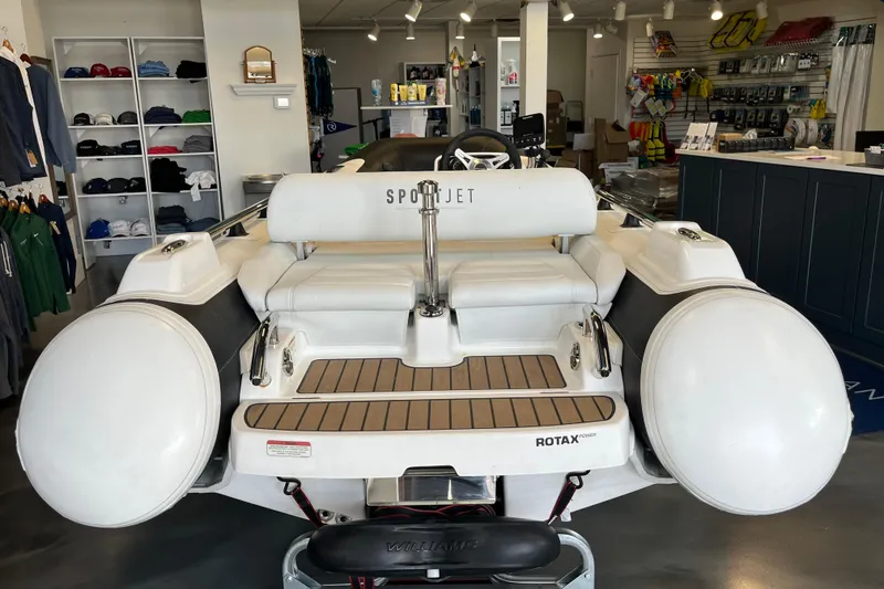 Slide: The Image of 2023 Williams Jet Tenders Sportjet 345 displayed in a showroom with accessories. - 3