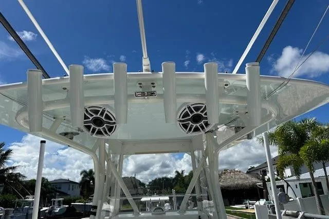 Slide: The Image of 2024 SeaVee 340Z boat with speakers and rod holders under a clear blue sky. - 11