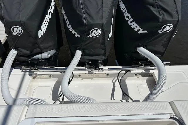 Slide: The Image of 2024 SeaVee 340Z boat with triple Mercury engines, rear view. - 19