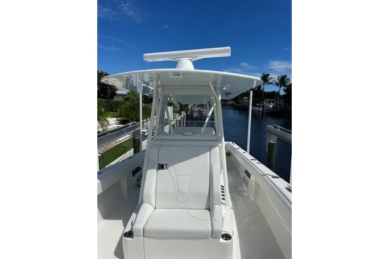 Slide: The Image of 2024 SeaVee 340Z boat docked, featuring sleek design and modern amenities. - 2