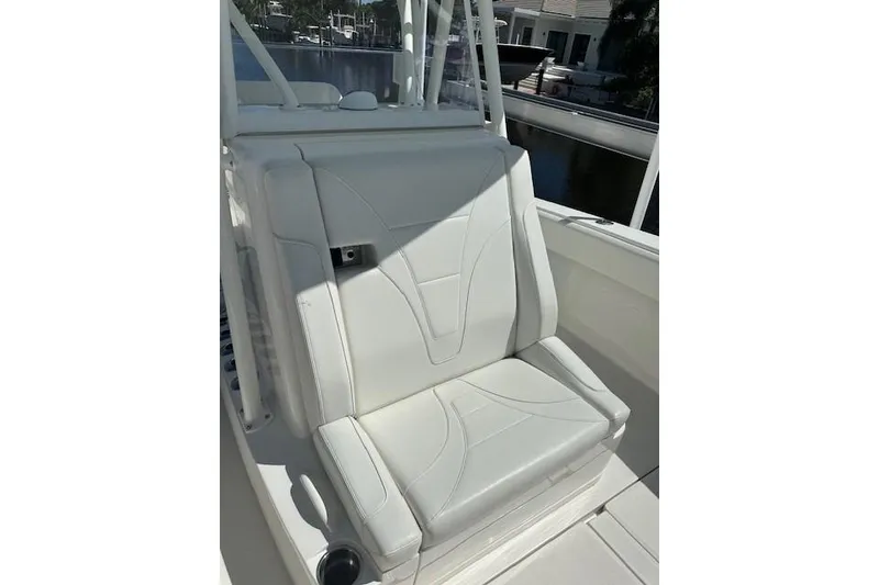 Slide: The Image of 2024 SeaVee 340Z boat seat, white upholstery, sleek design, outdoor setting. - 3