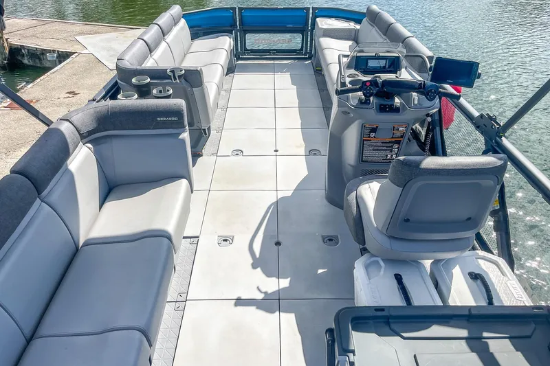 Slide: The Image of 2023 Sea-Doo Switch Cruise 21 interior with spacious seating and modern controls. - 10