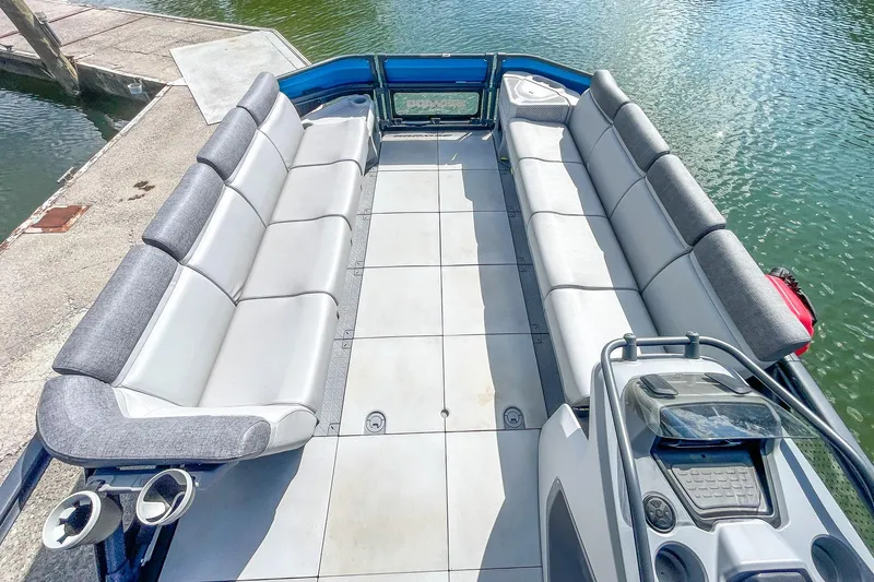 Slide: The Image of 2023 Sea-Doo Switch Cruise 21 pontoon boat interior with spacious seating and modern design. - 11