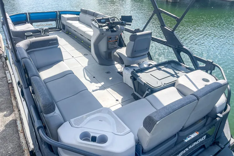 Slide: The Image of 2023 Sea-Doo Switch Cruise 21 pontoon boat interior with spacious seating and modern controls. - 3